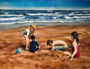 kids playing in the sand on a beach